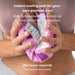 Frida Baby Instant Ice Maxi Pad being activated by a person in a close-up, home setting.
