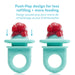 Frida Baby Push Pop Feeder filled with fruit, shown upright on a white background.