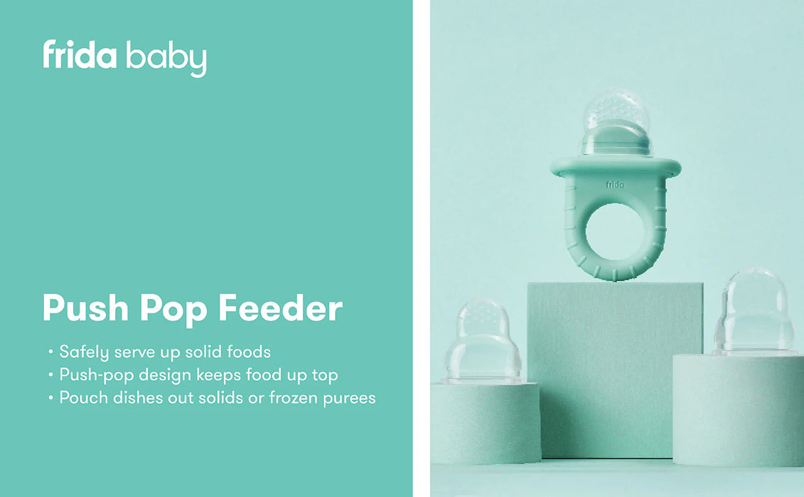 Frida Baby Push Pop Feeder displayed on pastel blocks with two clear caps beside it.