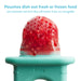 Frida Baby Push Pop Feeder with fresh fruit, close-up of silicone pouch and teal handle.