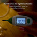 Frida Quick-Read Rectal Thermometer with backlit screen displaying 98.2°F held in hand at night.