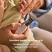 Frida Baby Snipper Clipper nail clipper being used to trim a baby's nails close-up.