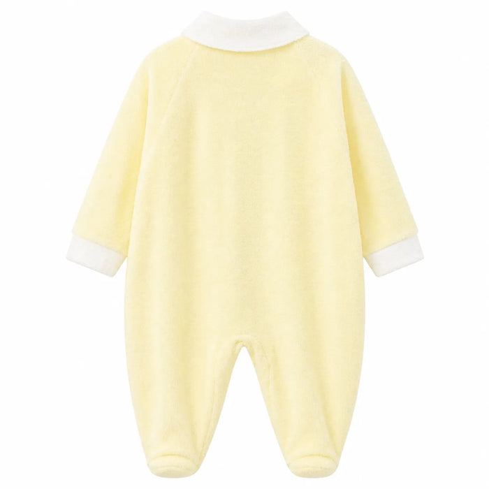 Soft yellow baby pyjama with white collar and cuffs, shown flat on a white background.