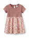 Guili Guili Rose Elegance baby dress with short sleeves and pink floral-patterned skirt on white background.