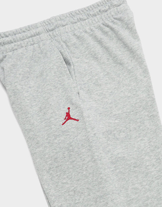 Jordan kids' grey sweatpants with red Jumpman logo, shown flat on a white background.