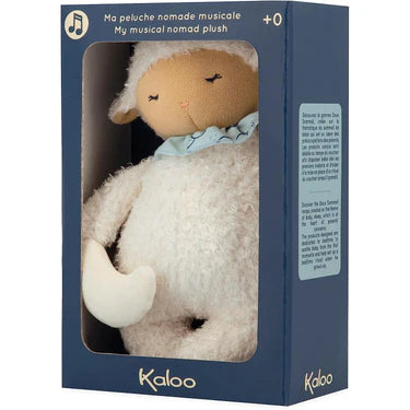 Kaloo Nomade Musical Sheep plush toy in soft white, displayed in original blue box packaging.