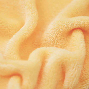 Kaloo yellow rabbit baby comforter soft yellow plush fabric in a close-up view.