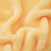Kaloo yellow rabbit baby comforter soft yellow plush fabric in a close-up view.