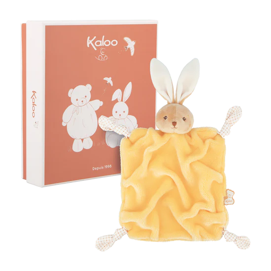Kaloo yellow rabbit baby comforter with plush bunny head, shown in front of its gift box.