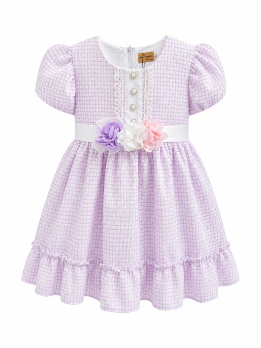 Kids Energy floral lilac dress with puff sleeves and flower belt shown on a plain white background.