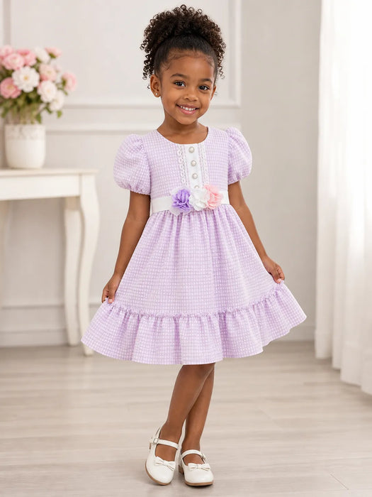 Kids Energy Floral Lilac Dress worn by a little girl standing and smiling in a bright room.