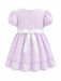 Kids Energy Floral Lilac Dress with puff sleeves, back zipper, and white bow, shown from the back.