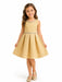 Kids Energy gold rhinestone textured dress worn by a girl standing and smiling against a white background.