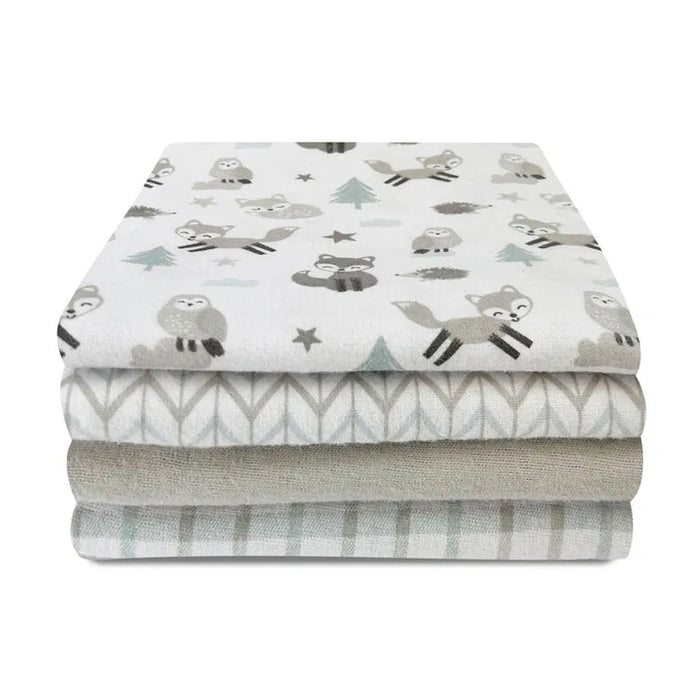 Koala Baby 4-pack flannel receiving blankets folded in a stack, featuring forest animal prints.