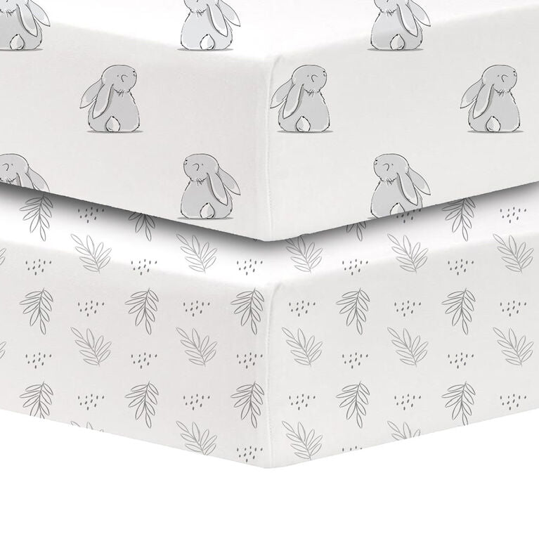 KoalaBaby 2-Pack Percale Sheets with grey bunny and leaf patterns stacked on a crib mattress.