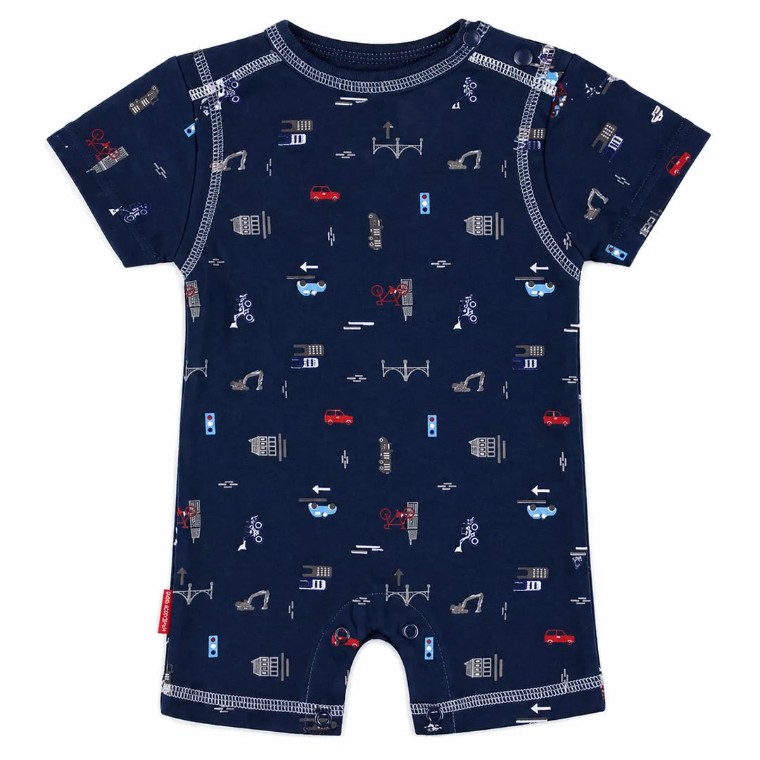 Kushies navy romper with short sleeves, road and vehicle pattern, laid flat on a white background.