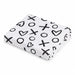 Kushies jersey fitted crib sheet folded, white with black X, O, and heart pattern.