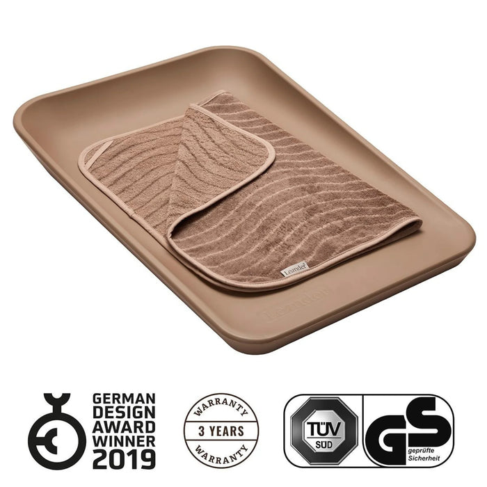 Leander Matty baby changing waterproof mat in taupe, displayed with a matching towel on top.