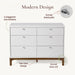 Little Seeds Laurel 6-drawer dresser with white finish and wood base, shown front view.