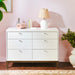 Little Seeds Laurel 6-Drawer Dresser styled in a nursery with books, lamp, and decor on top.