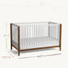 Little Seeds Laurel Island convertible crib in white and wood finish, shown with size measurements.
