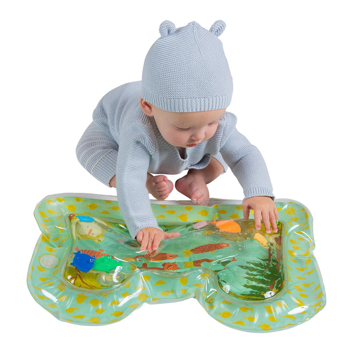 Manhattan Toy Riverbend Water Play Mat with baby sitting and playing on colorful mat.