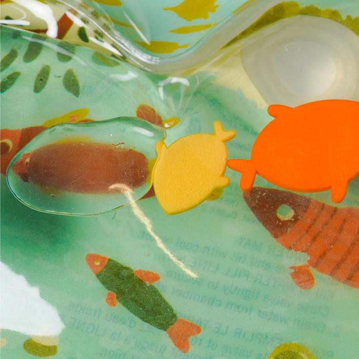 Manhattan Toy Riverbend Water Play Mat close-up showing floating fish shapes and water inside the mat.