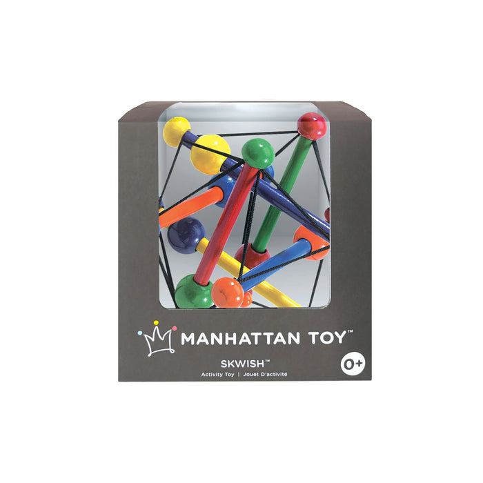 Manhattan Toy Skwish wooden rattle teether in colorful packaging, shown inside its box.
