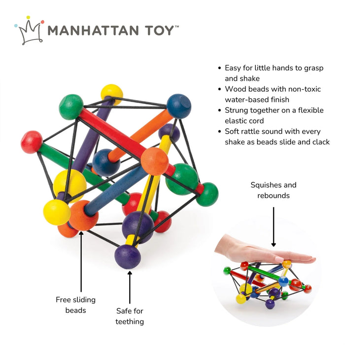 Manhattan Toy Skwish wooden rattle teether shown on a white background, with a hand pressing it down to show flexibility.