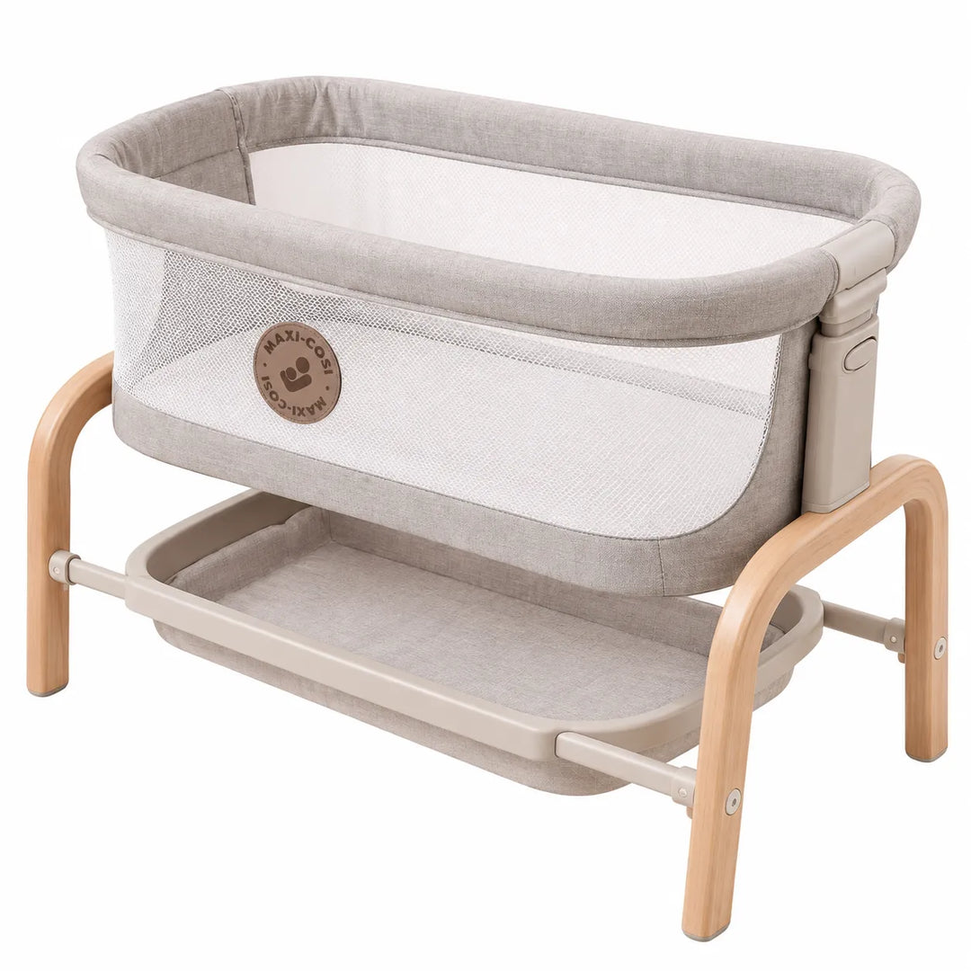 Maxi-Cosi Iora Doll Bassinet with mesh sides and storage shelf for imaginative pretend play.