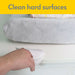 Medela Quick Clean breast pump wipes cleaning a white hard surface near a soft changing pad.