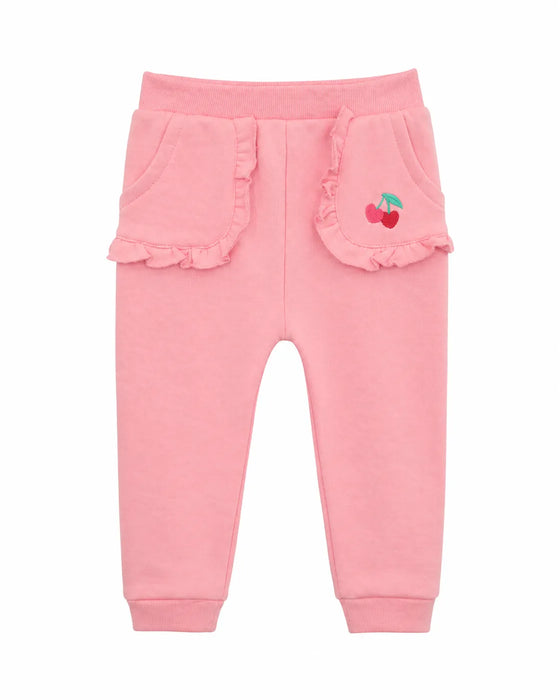 Mid Baby Cherry Blossom Comfort Pants in pink with ruffle pockets and cherry embroidery, laid flat.