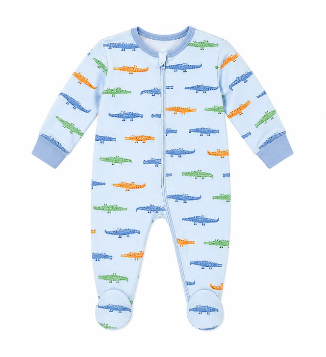 Baby pyjama with colorful crocodile print, shown flat on a white background.