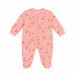 Mid Comfort baby pyjama in pink, decorated with cherry and bow prints, displayed on a white background.
