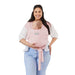 Moby Easy Wrap Baby Carrier Rose with baby in front, worn by smiling woman against white background.