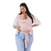 Moby Easy Wrap Baby Carrier in rose worn by a woman carrying a baby on her front.