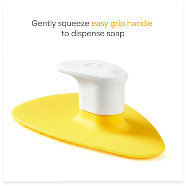 Brosse de bain en silicone Munchkin® Squeeze & Scrub avec distributeur de savon