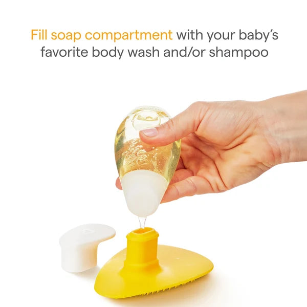 Brosse de bain en silicone Munchkin® Squeeze & Scrub avec distributeur de savon