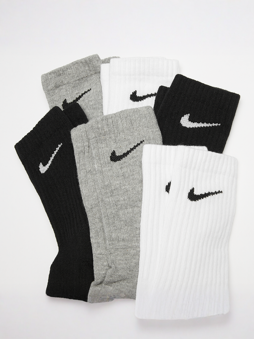 Nike Dri-FIT cushioned crew socks six-pack in black, grey, and white, laid flat on a white surface.