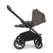 Nuna Mixx Next baby stroller in side view with canopy extended and storage basket visible.