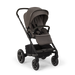 Nuna Mixx Next baby stroller in grey fabric shown angled on a plain black background.