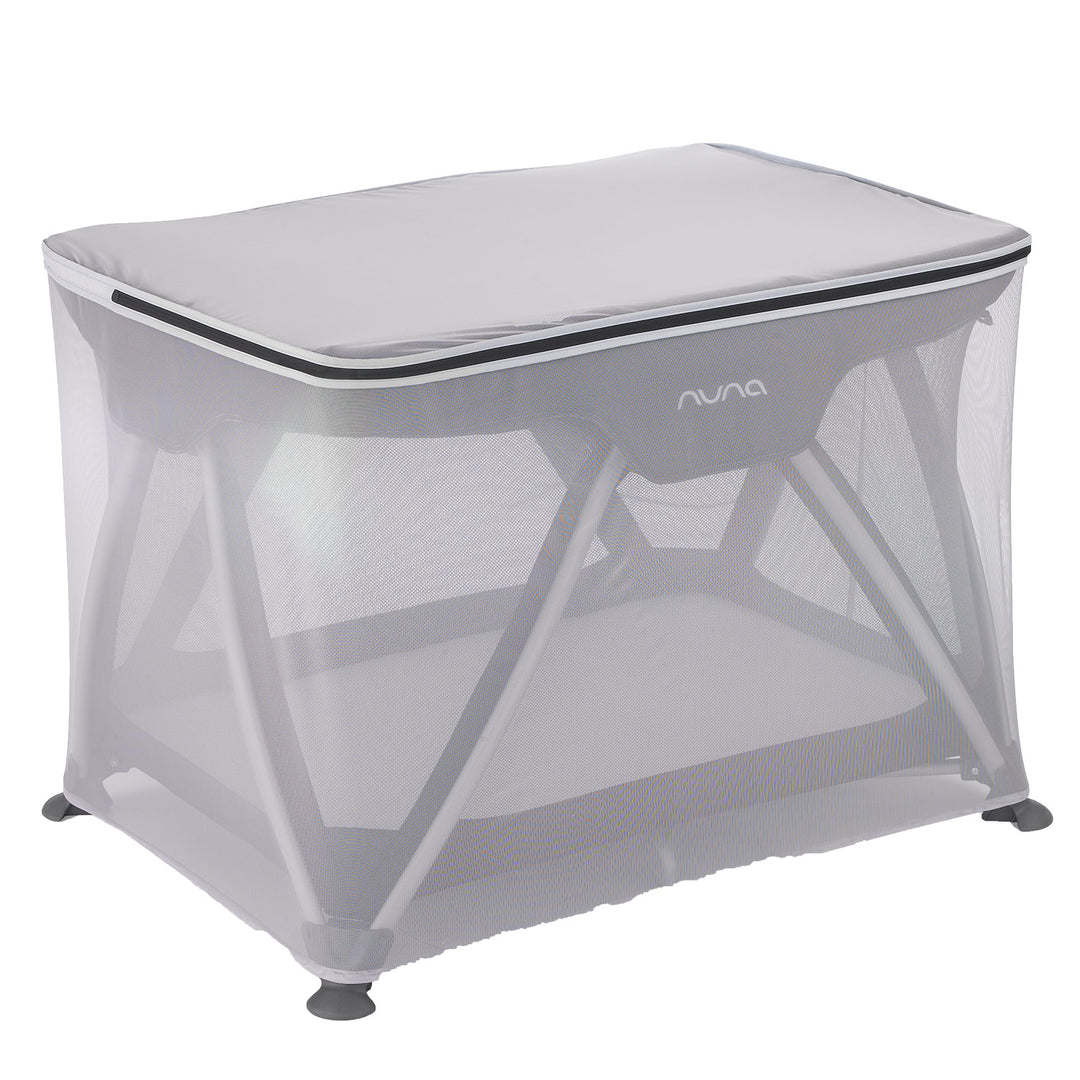 Nuna Sena insect net covering a playard in a well-lit studio setting.