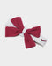 Nike baby headband with a large pink bow and embroidered logo, displayed on a white background.