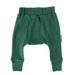 Parade Organics cotton baby harem pants in solid green laid flat on a white background.