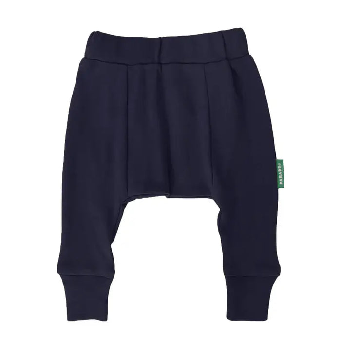 Parade Organics cotton baby harem pants in navy blue displayed on a white background.