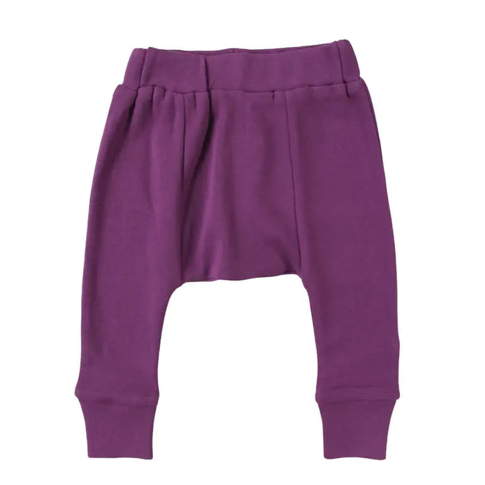 Parade Organics cotton baby harem pants in purple shown flat on a white background.