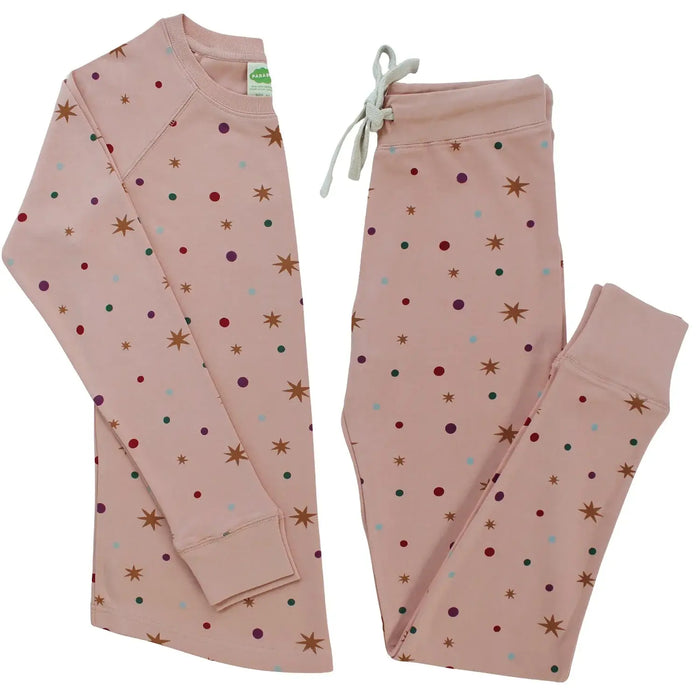 Parade Organics organic cotton kids pajamas with pink fabric, star and dot pattern, laid flat.