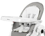 Peg Perego Prima Pappa high chair with white booster cushion and harness, shown in profile view.