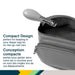 Compact nail clipper with grey handle placed in an open diaper bag, ideal for baby nail care.