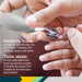Adult using gray baby nail clippers to trim child's fingernails, close-up.